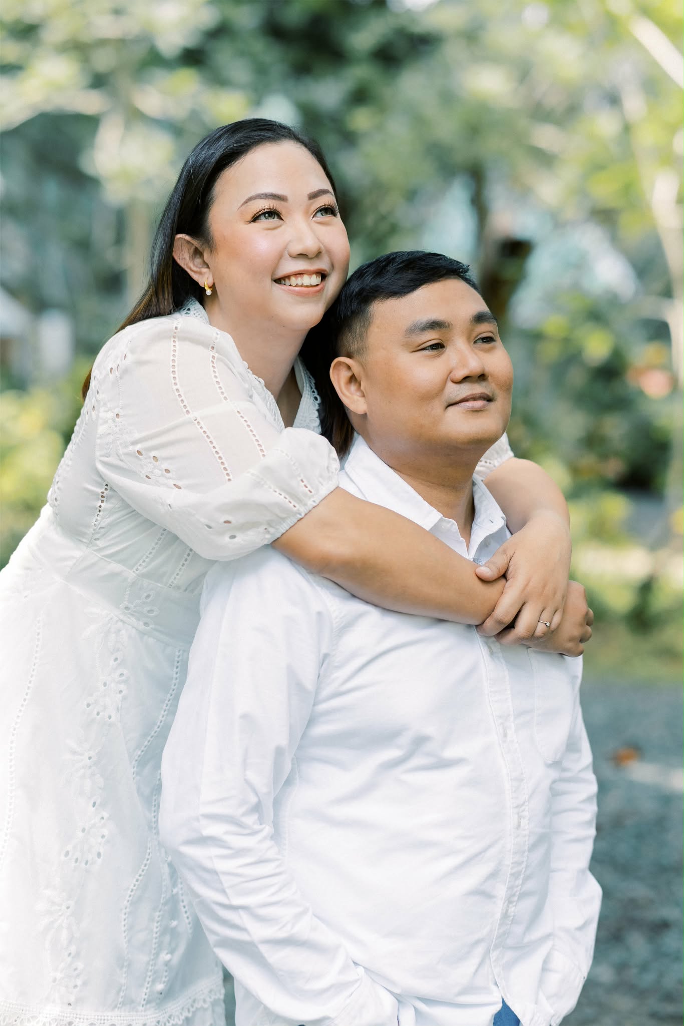 Couple embracing in white