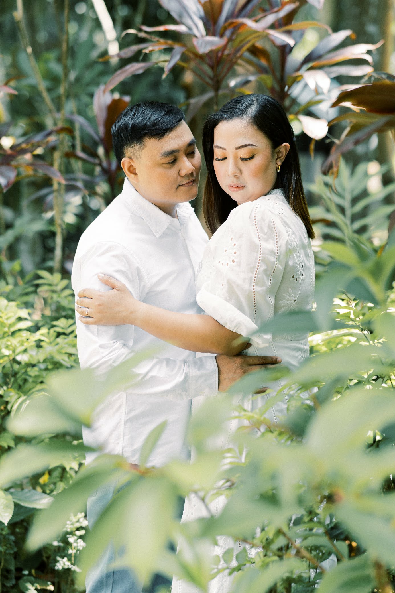 Couple in white in garden